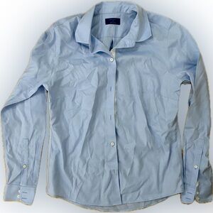 Baby blue button up shirt.